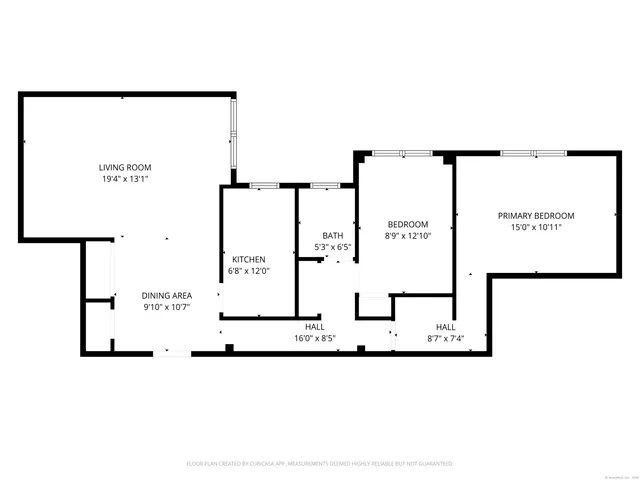a picture of a bench in front of a gate