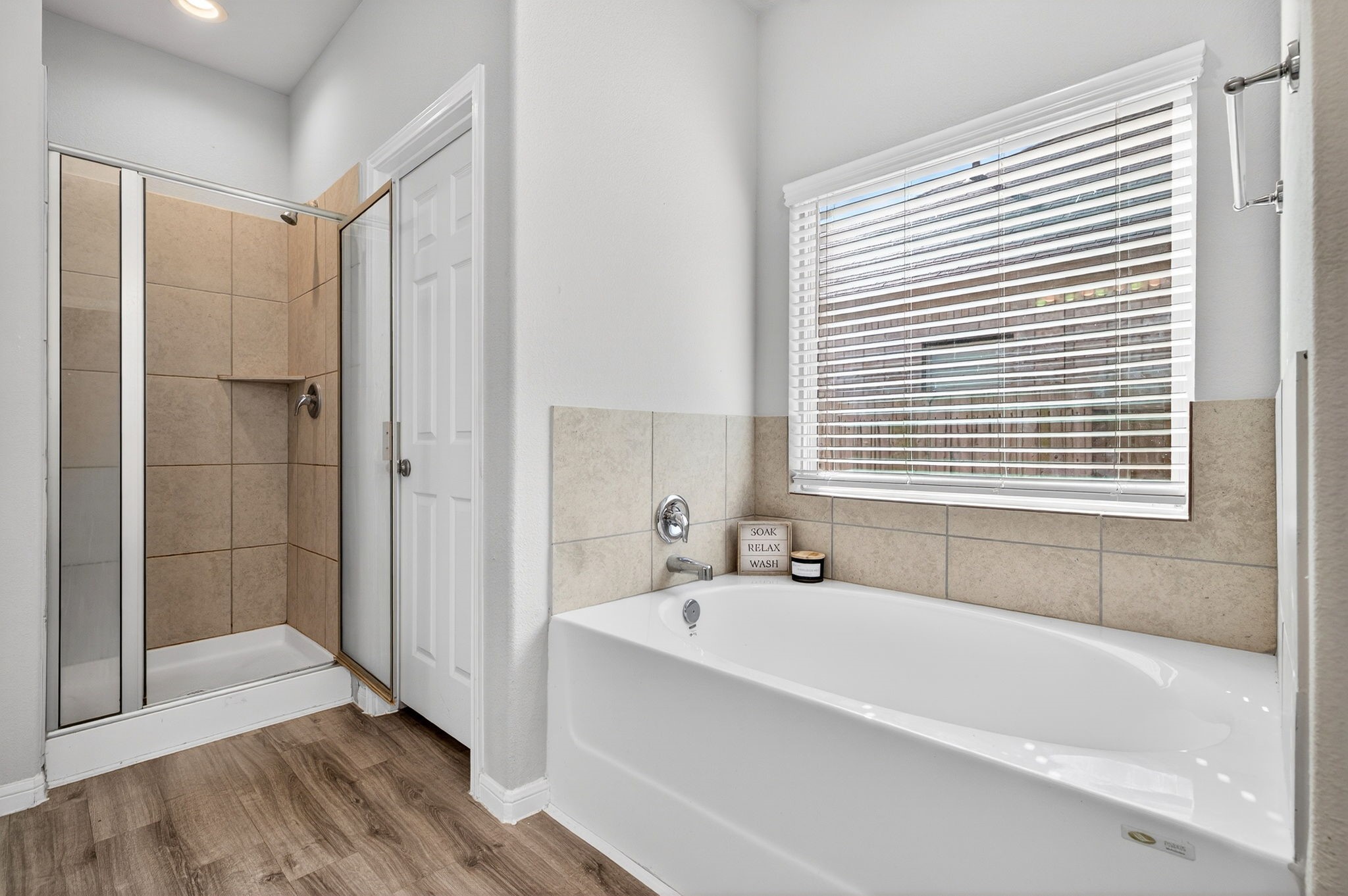 2121 Cedar Way Drive Conroe, TX 77301 - Photo 15 of 27 a bathroom with a bathtub and a shower