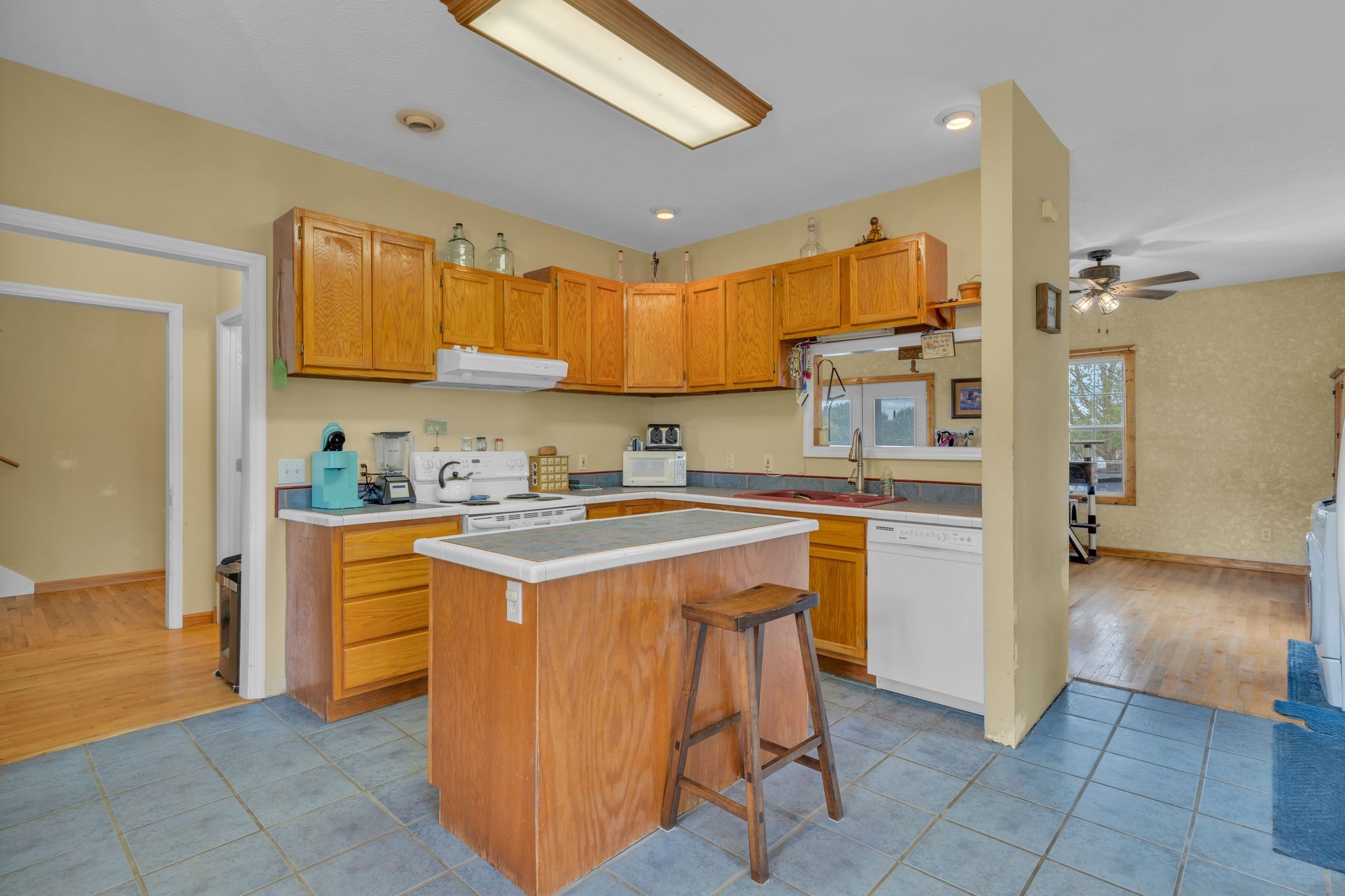 1584 Errel Dowlen Road Pleasant View, TN 37146 - Photo 11 of 28 a kitchen with stainless steel appliances granite countertop a sink and a refrigerator