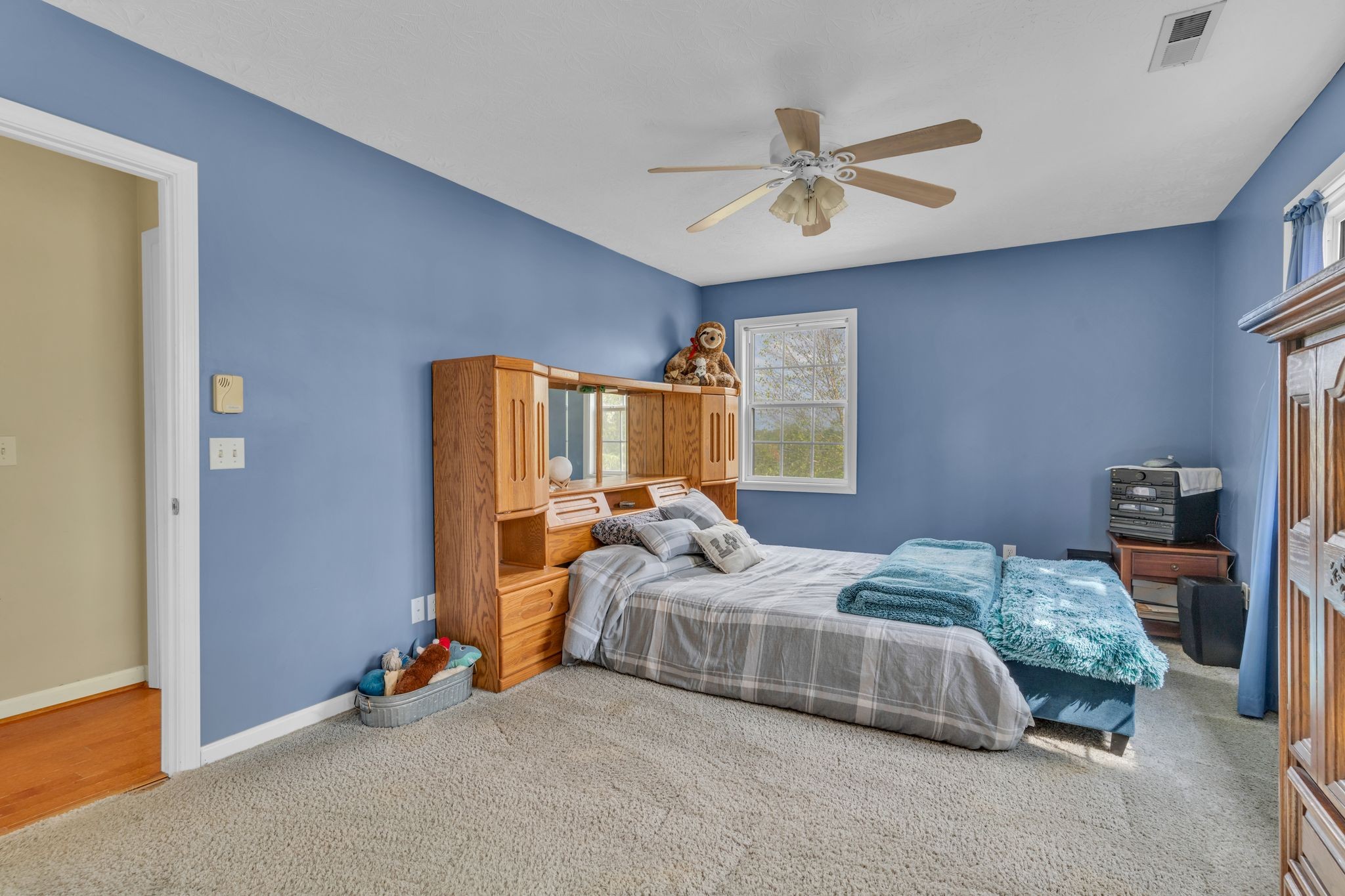 1584 Errel Dowlen Road Pleasant View, TN 37146 - Photo 19 of 28 a bedroom with a bed and a chandelier