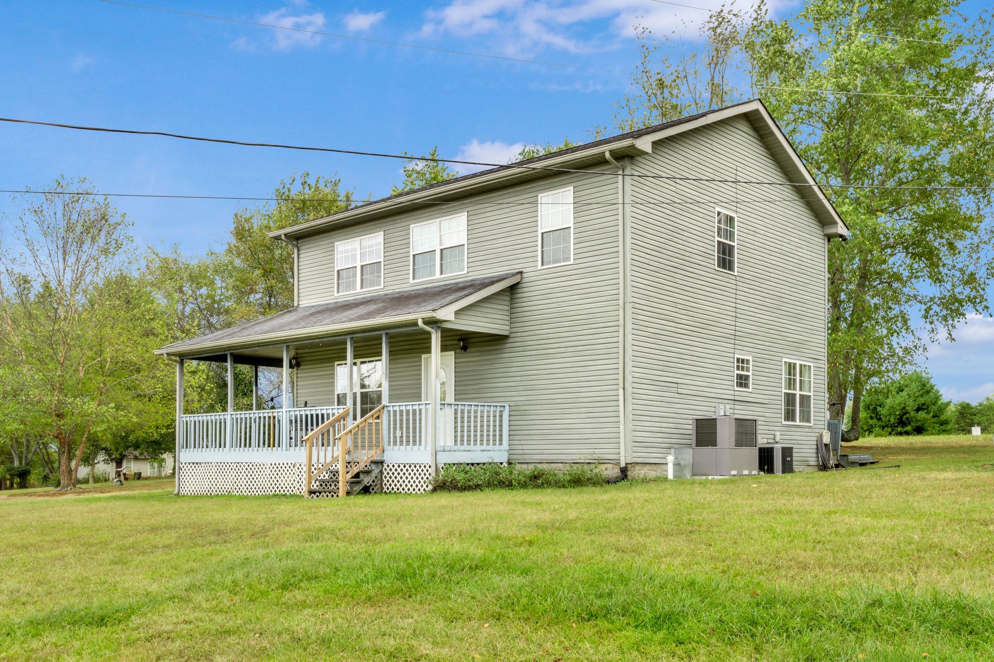 1584 Errel Dowlen Road Pleasant View, TN 37146 - Photo 4 of 28 a front view of a house with a garden