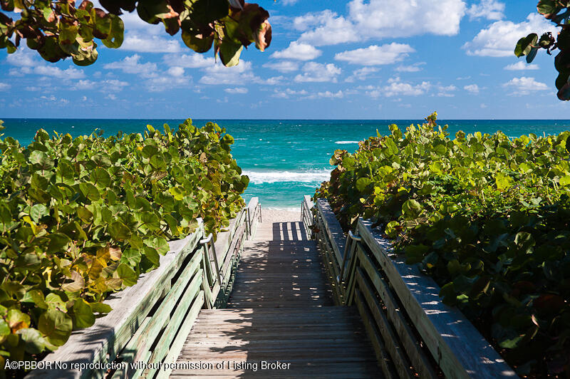 120 Jupiter Key Road, Unit PH 4 Jupiter, FL 33477 - Photo 18 of 20 a view of a balcony with wooden floor
