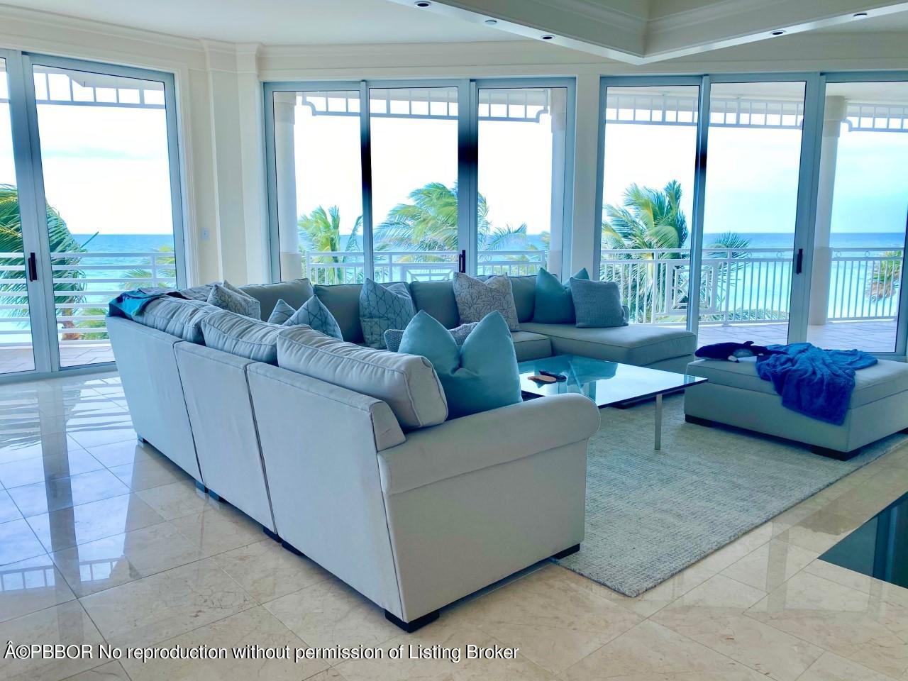 120 Jupiter Key Road, Unit PH 4 Jupiter, FL 33477 - Photo 2 of 20 a living room with furniture and a large window