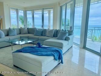 120 Jupiter Key Road, Unit PH 4 Jupiter, FL 33477 - Photo 4 of 20 a living room with furniture and a large window