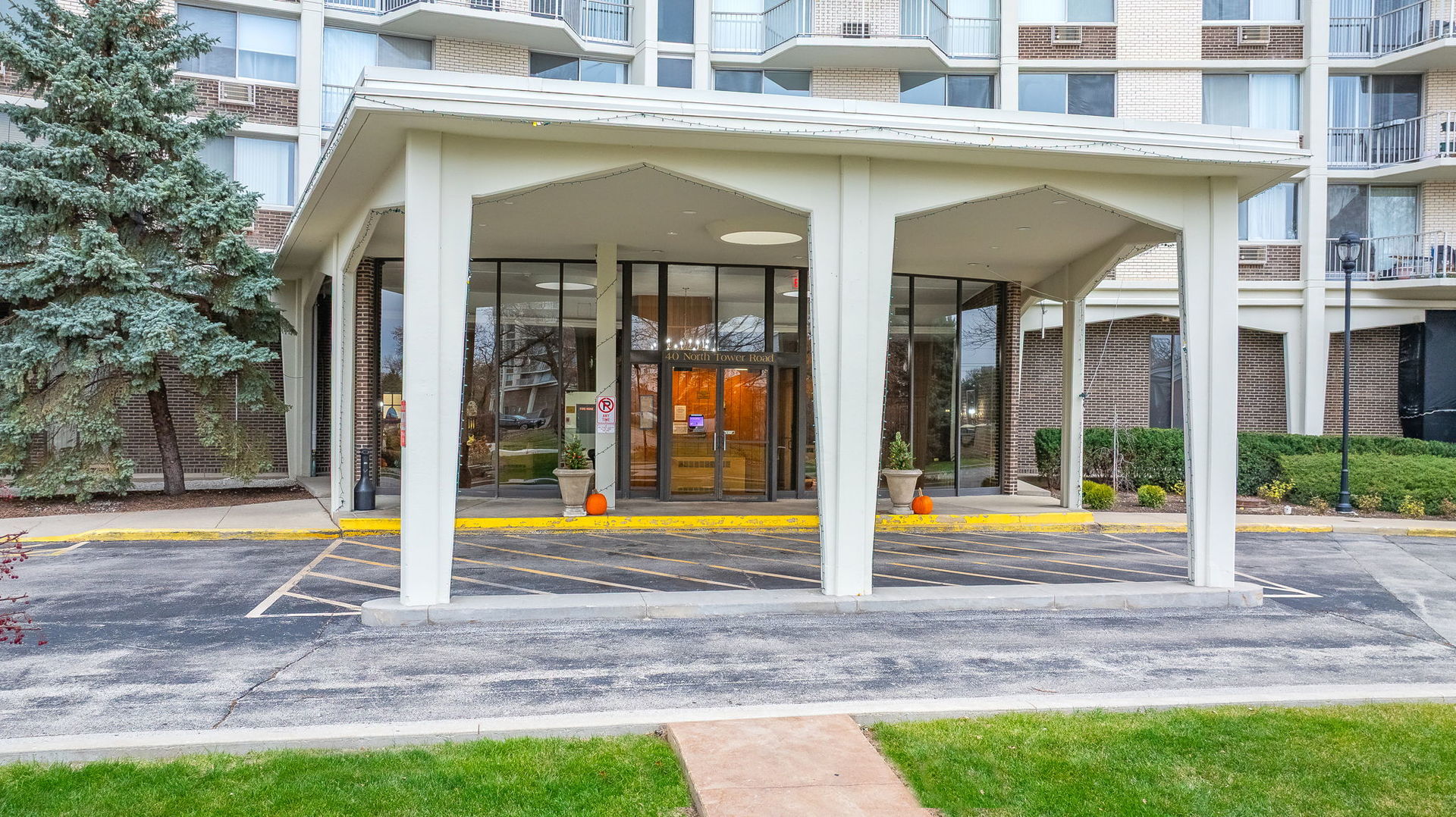 40 North Tower Road, Unit 4M Oak Brook, IL 60523 - Photo 1 of 17 a view of a building with a swimming pool
