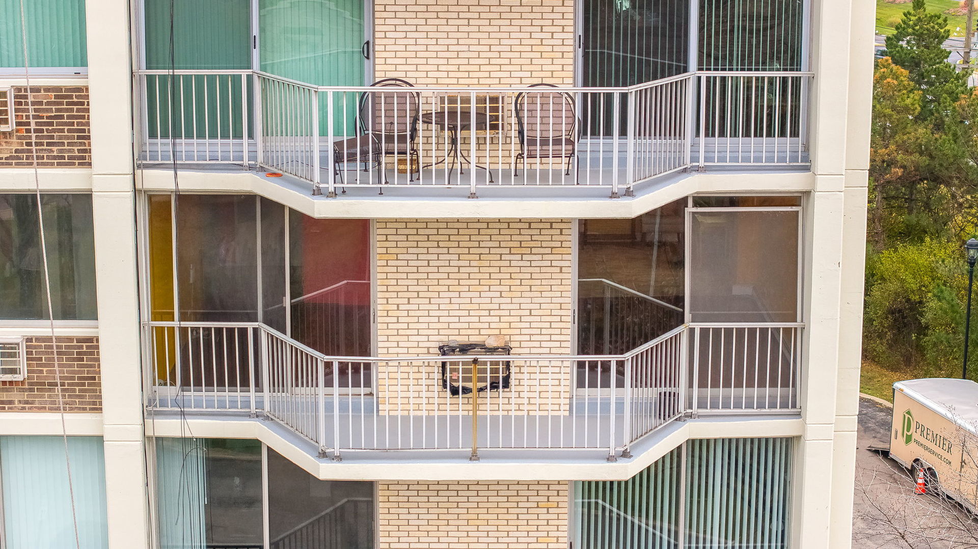 40 North Tower Road, Unit 4M Oak Brook, IL 60523 - Photo 7 of 17 a front view of a house with a fence