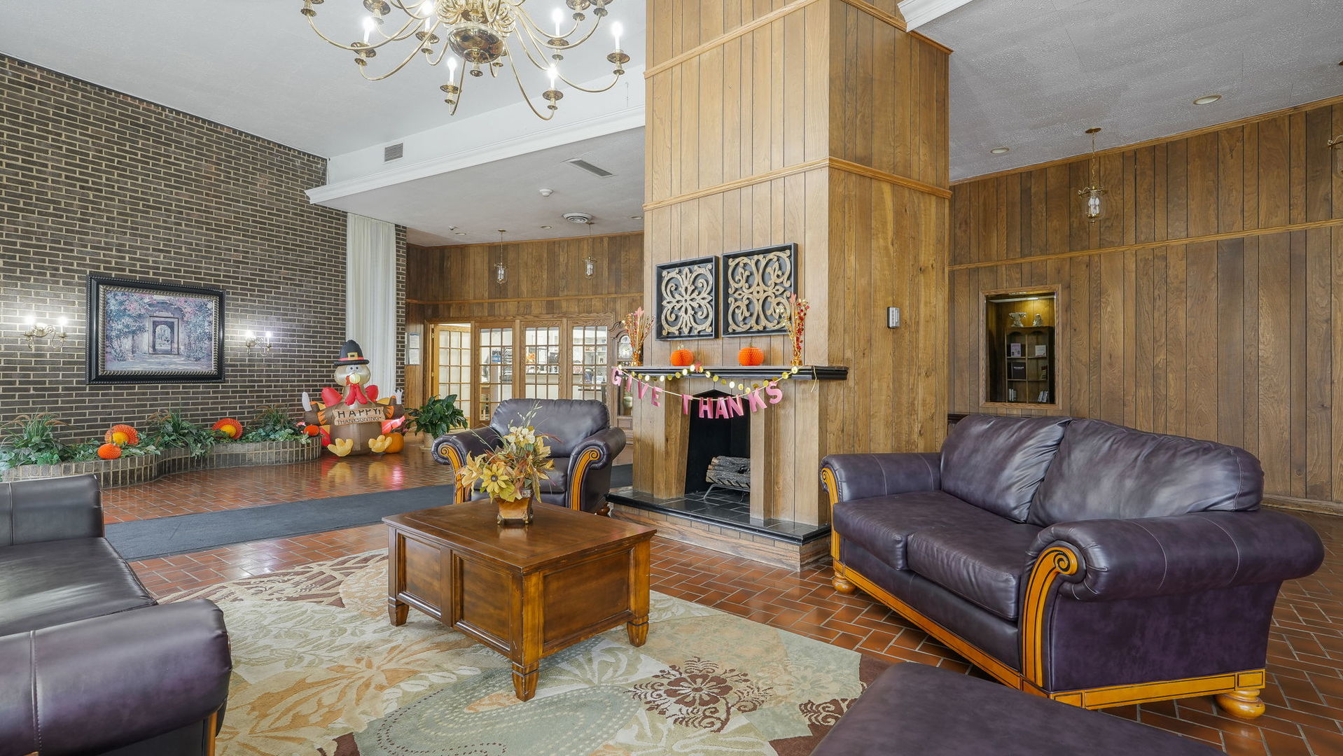 40 North Tower Road, Unit 4M Oak Brook, IL 60523 - Photo 10 of 17 a living room with furniture and a chandelier