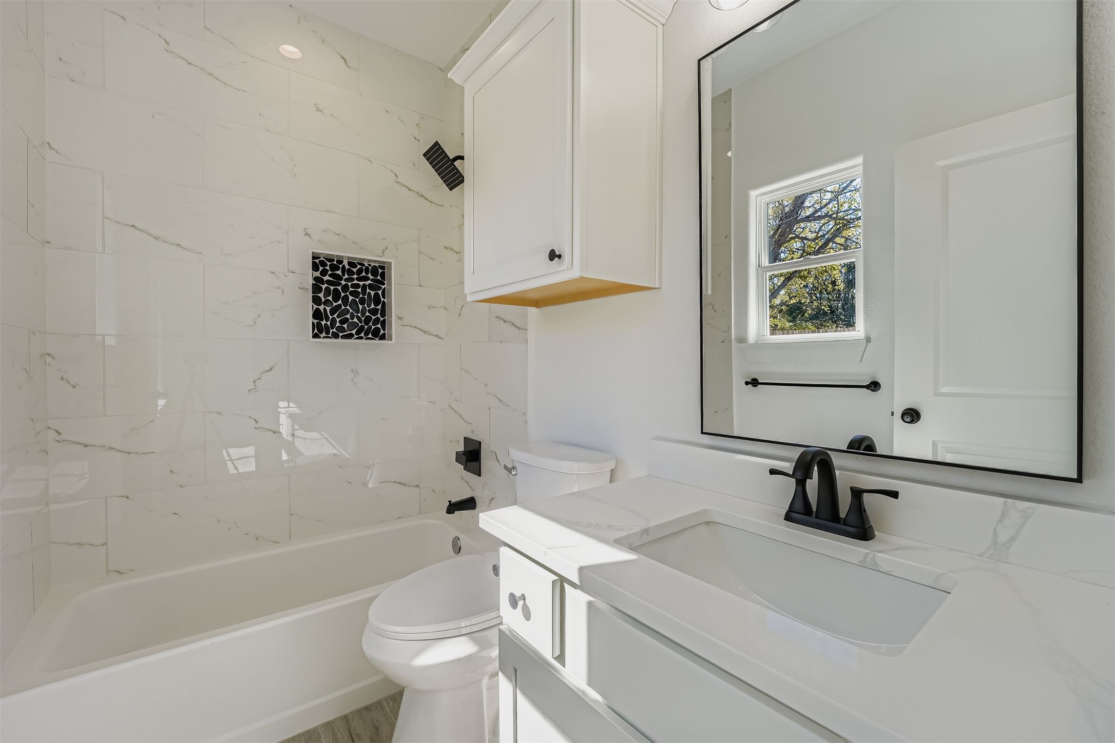 701 East 3rd Street Elgin, TX 78621 - Photo 21 of 35 Primary bathroom with shower combination and vanity