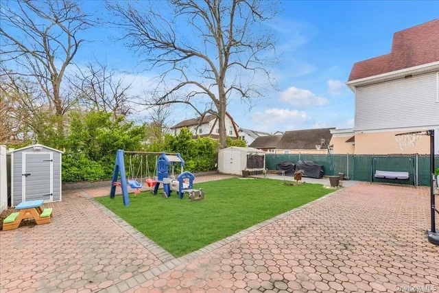 a view of a park with swings and slides