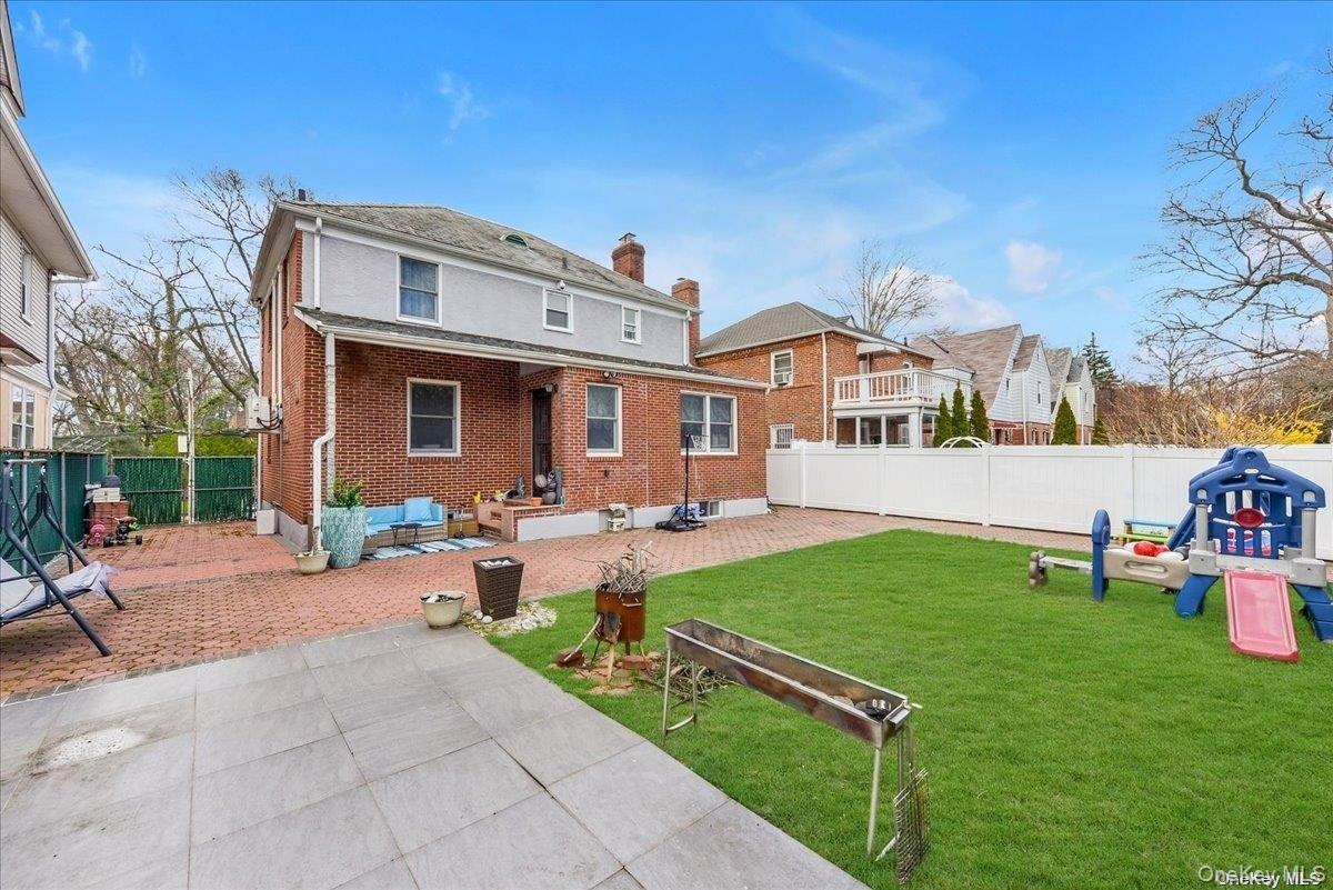 87-67 Chevy Chase Street Queens, NY 11432 - Photo 20 of 22 a view of a house with backyard and sitting area