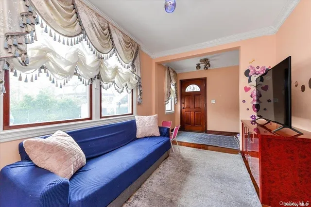 a living room with a couch and a flat screen tv