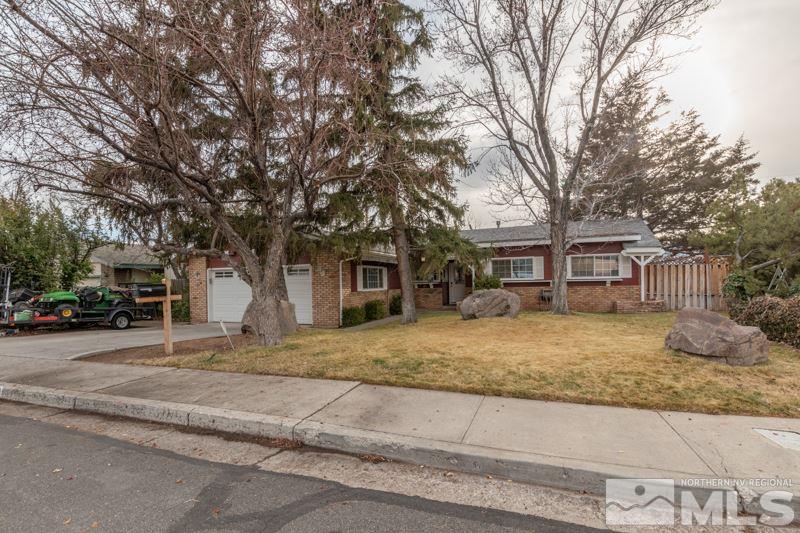 470 Tarn Way Reno, NV 89503 - Photo 18 of 18 a front view of a house with a yard and garage