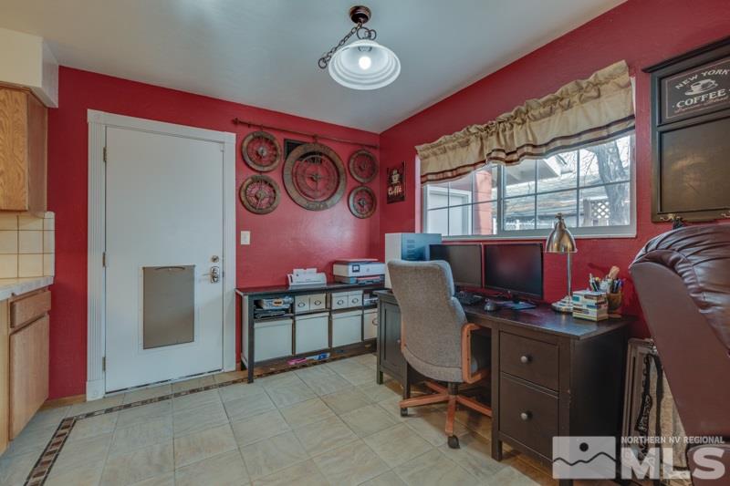 470 Tarn Way Reno, NV 89503 - Photo 8 of 18 a view of a workspace with furniture and a window