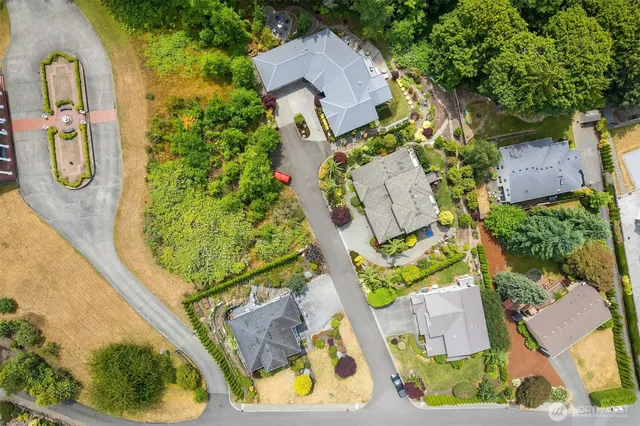 an aerial view of a house with a swimming pool