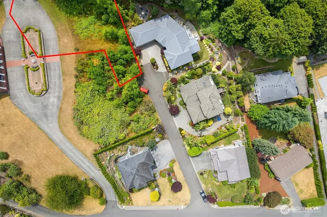 an aerial view of a house with swimming pool
