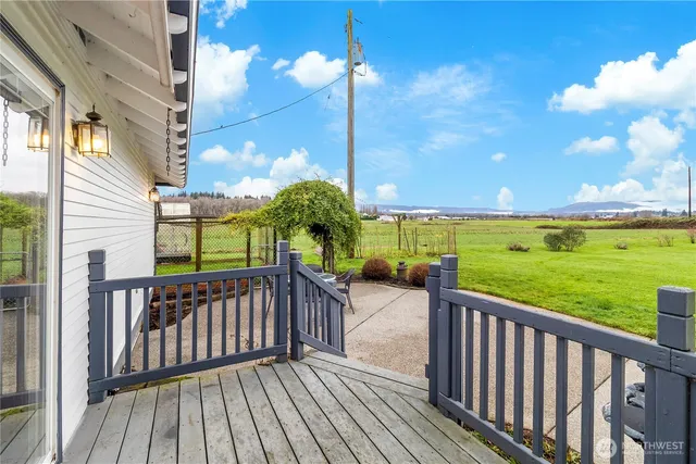a view of a balcony with wooden floor