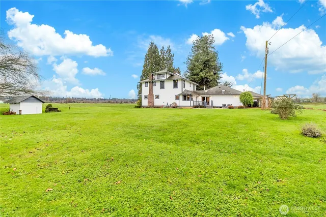 a view of a house with a big yard