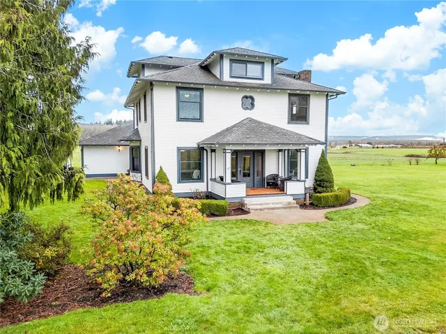 a front view of a house with swimming pool having outdoor seating
