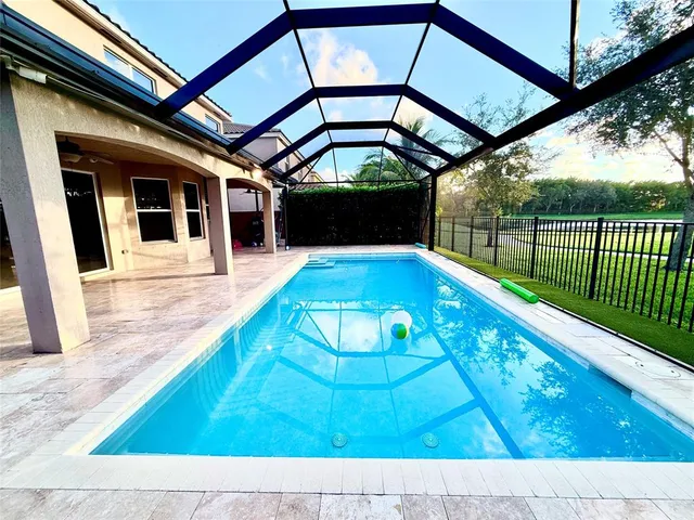 a view of swimming pool with a backyard