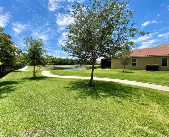 a view of a park with large trees
