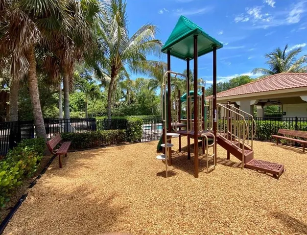 a view of a patio with a table chairs and a backyard