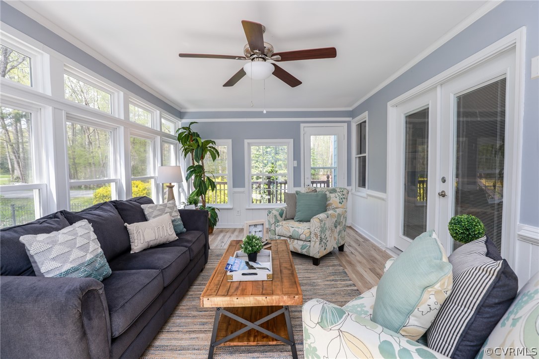 5600 North Chase Road Midlothian, VA 23112 - Photo 19 of 47 a living room with furniture ceiling fan and a large window