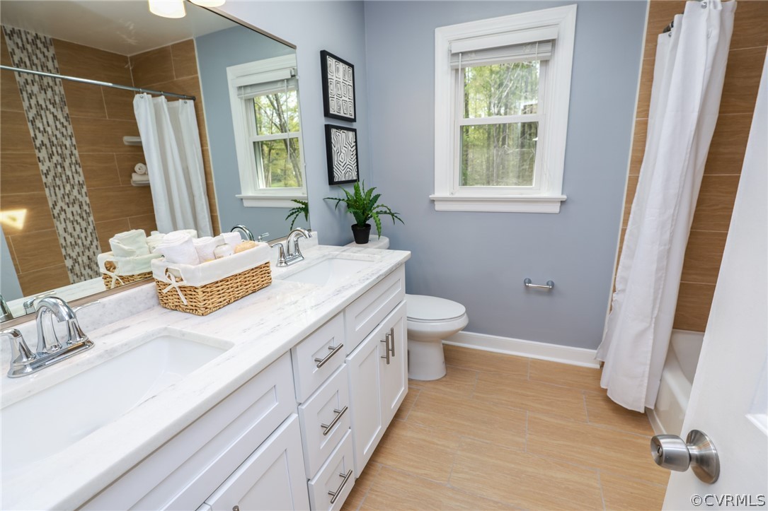 5600 North Chase Road Midlothian, VA 23112 - Photo 31 of 47 a spacious bathroom with a granite countertop sink and a mirror
