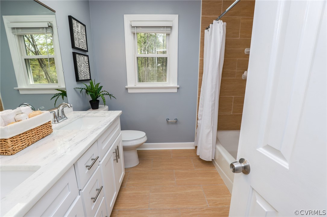 5600 North Chase Road Midlothian, VA 23112 - Photo 32 of 47 a spacious bathroom with a granite countertop sink and a mirror