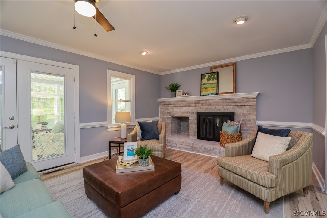 5600 North Chase Road Midlothian, VA 23112 - Photo 9 of 47 a living room with furniture and a fireplace