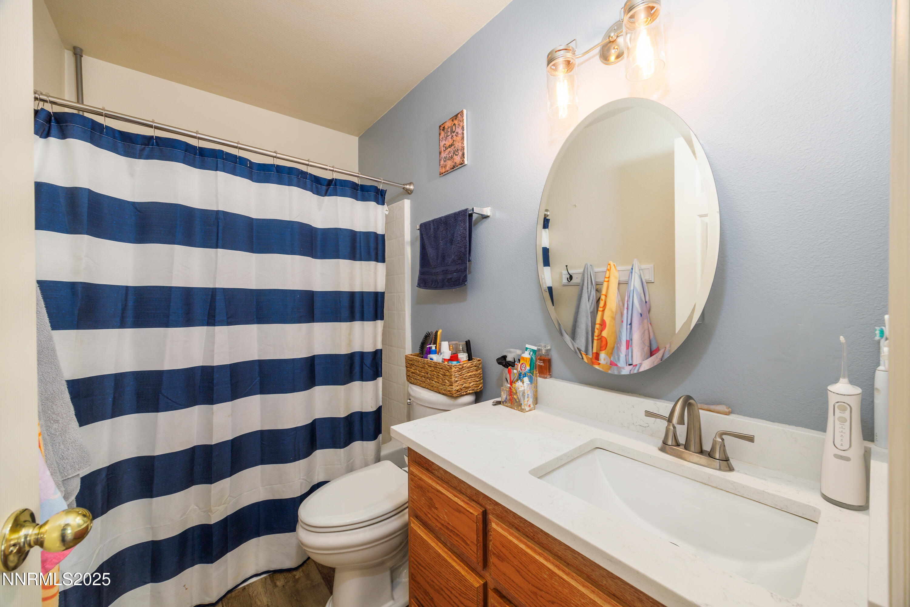 141 Country Ranch Road Fernley, NV 89408 - Photo 12 of 43 a bathroom with a sink toilet mirror and shower