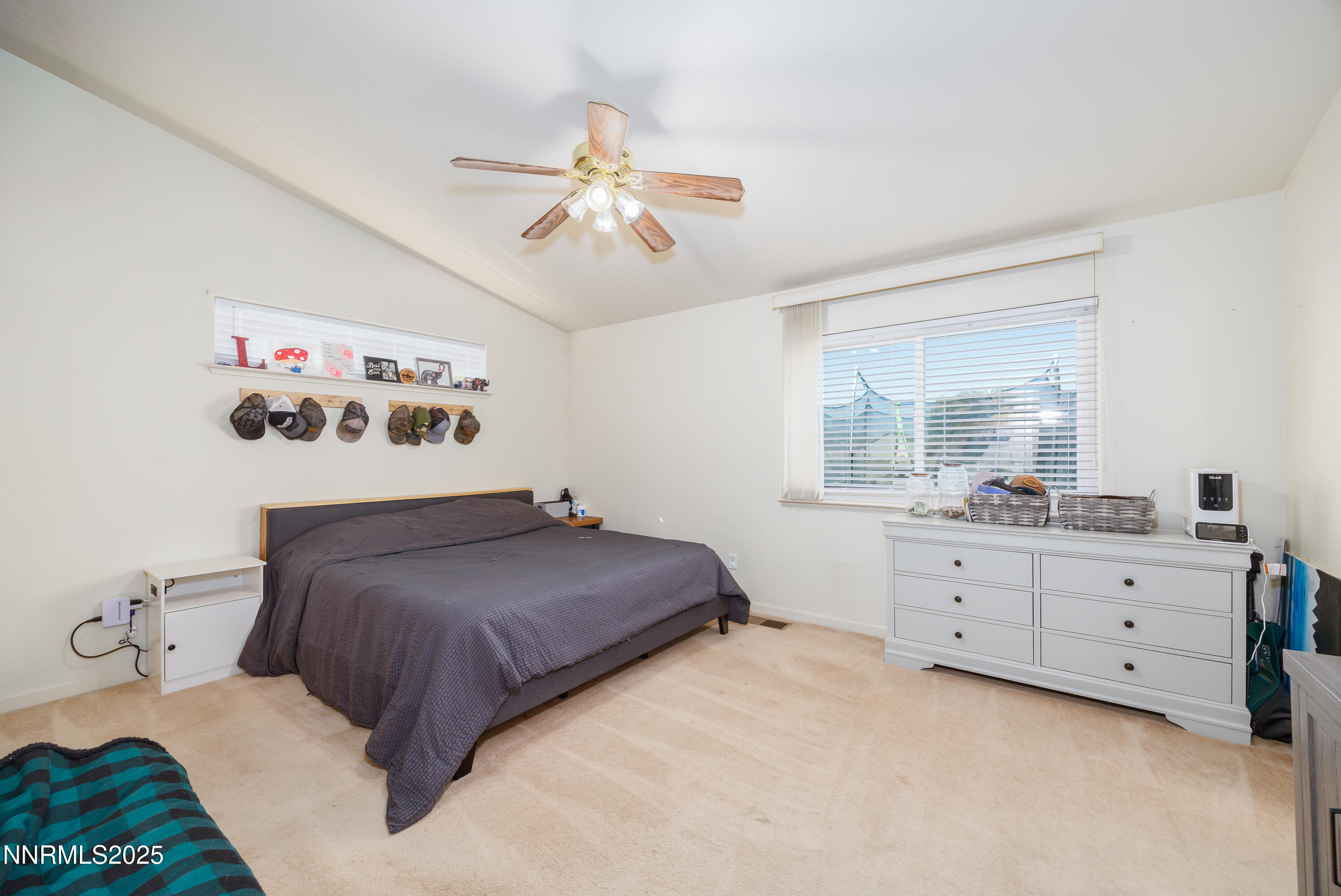 141 Country Ranch Road Fernley, NV 89408 - Photo 14 of 44 a bedroom with a bed and window