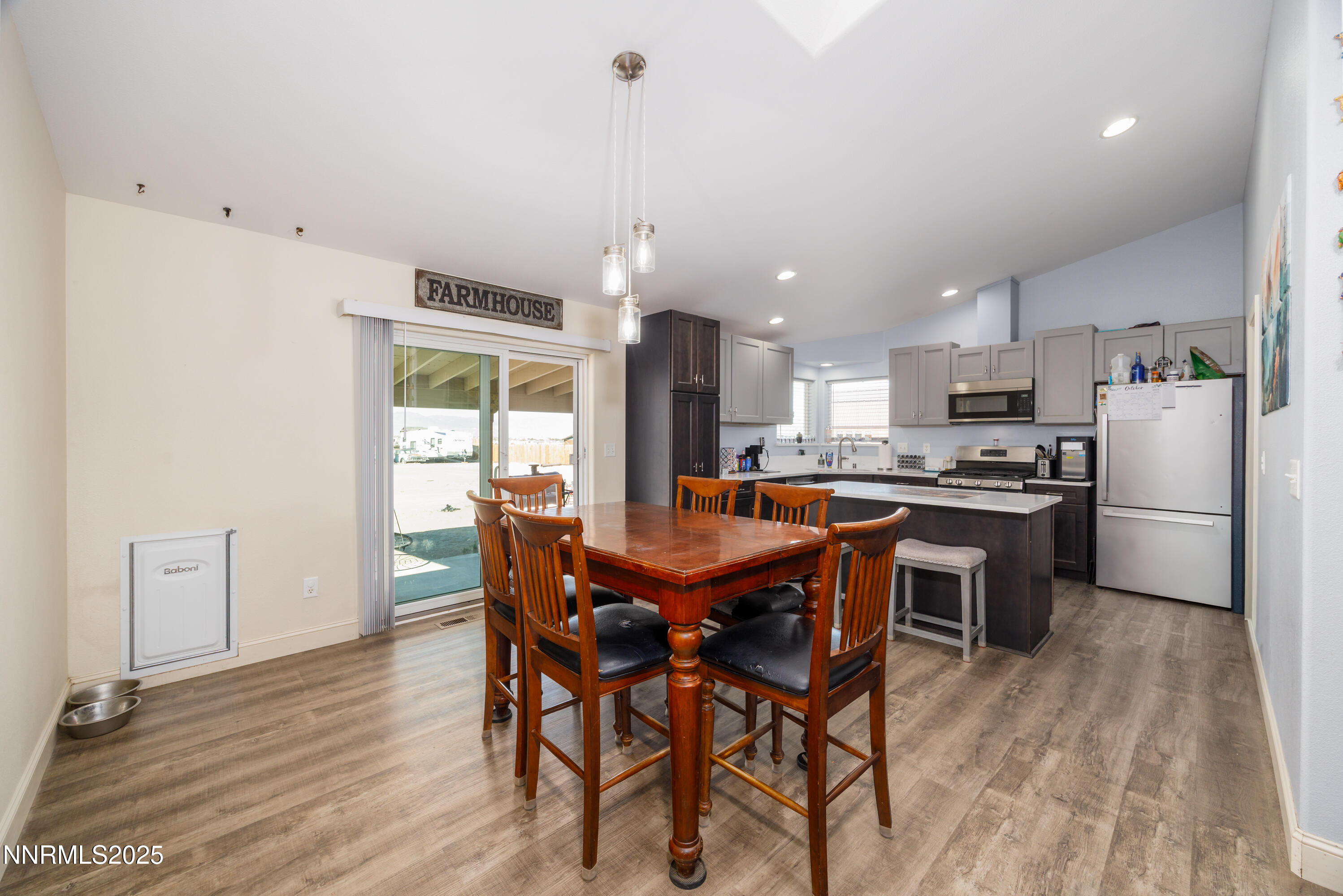 141 Country Ranch Road Fernley, NV 89408 - Photo 18 of 44 a view of a dining room with furniture and wooden floor