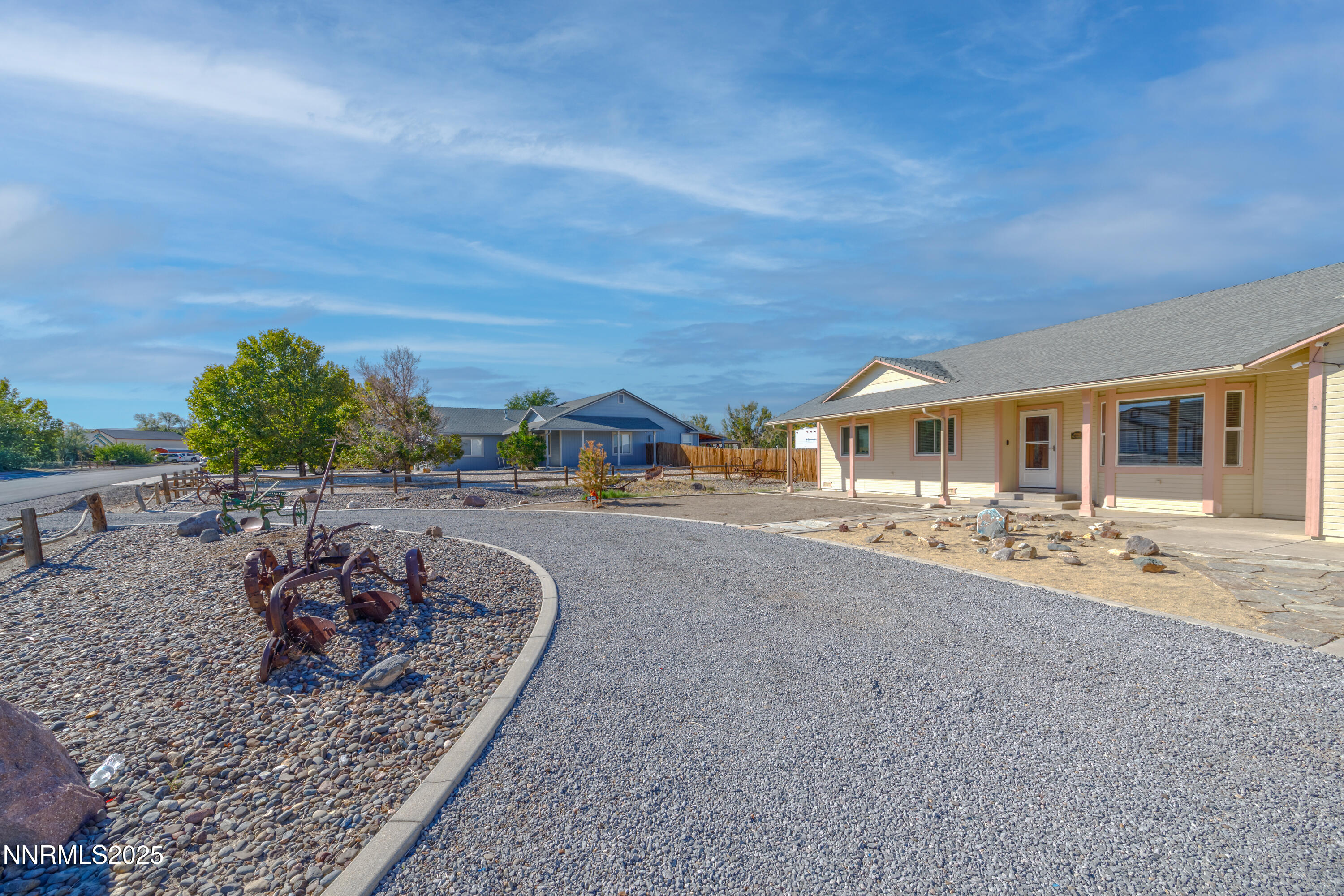 141 Country Ranch Road Fernley, NV 89408 - Photo 22 of 43 a view of a patio with a table and chairs and potted plants
