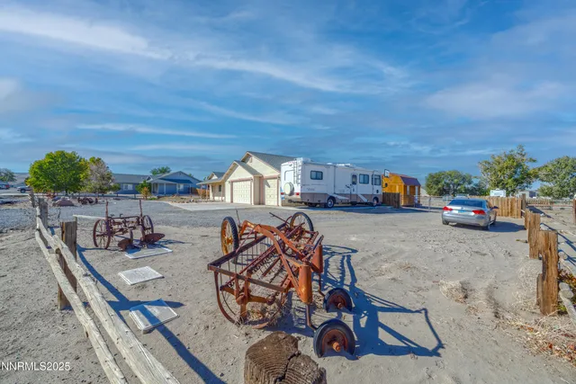 a view of street with parked cars