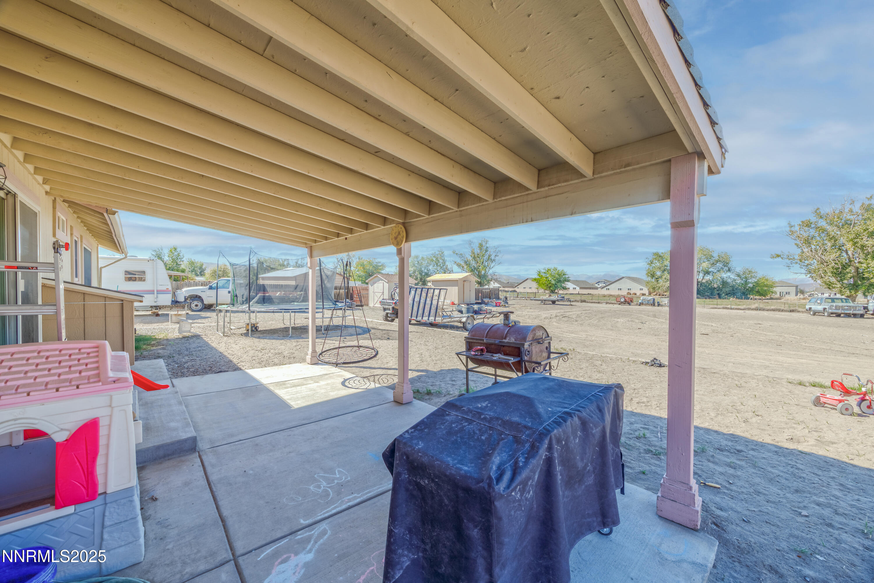 141 Country Ranch Road Fernley, NV 89408 - Photo 28 of 43 a view of a patio with swimming pool