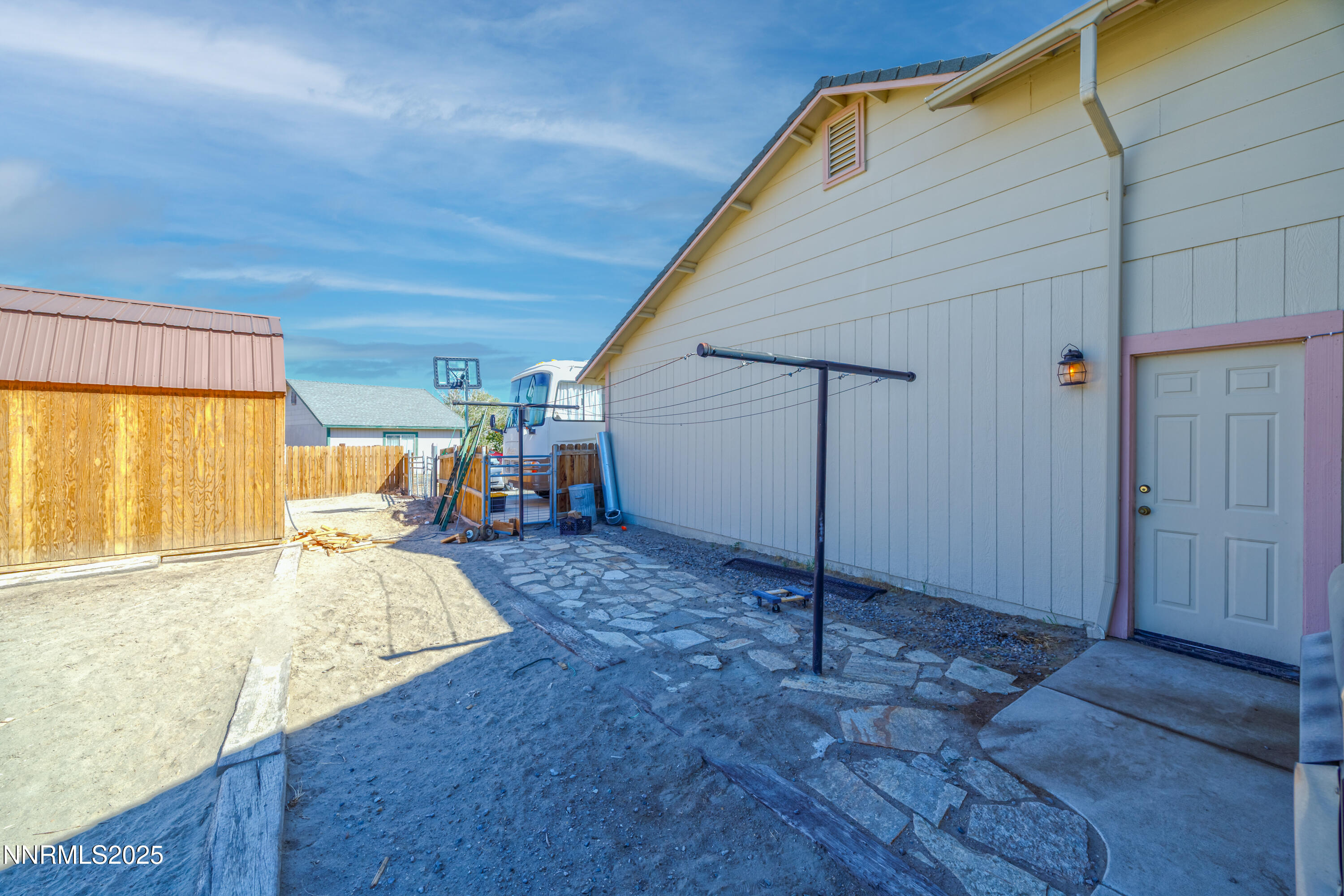 141 Country Ranch Road Fernley, NV 89408 - Photo 29 of 43 a view of a bedroom with wooden floor and a window