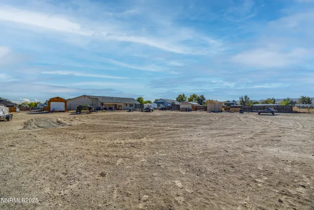 an aerial view of residential house with parking