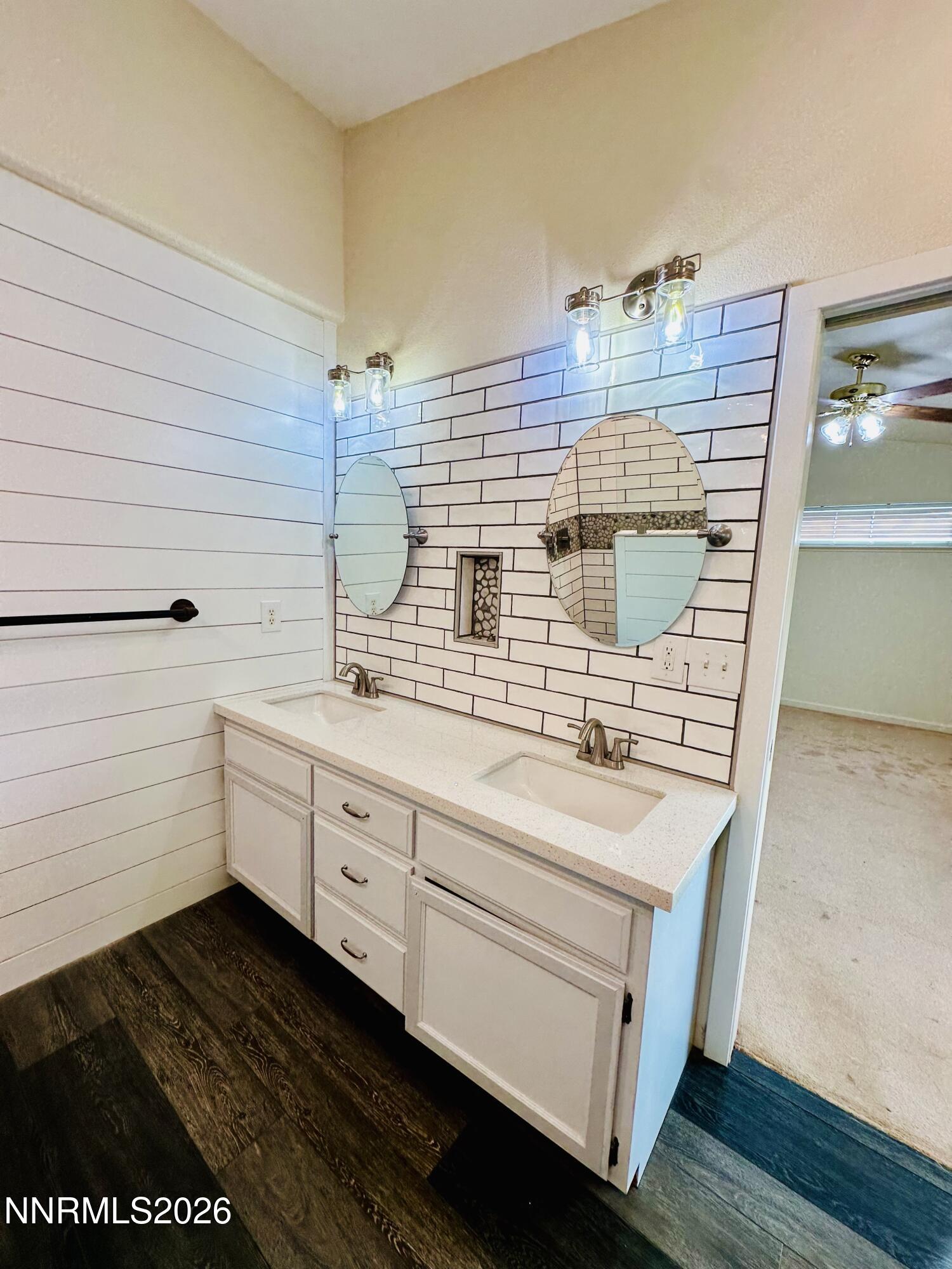 141 Country Ranch Road Fernley, NV 89408 - Photo 42 of 44 a bathroom with a sink and a mirror