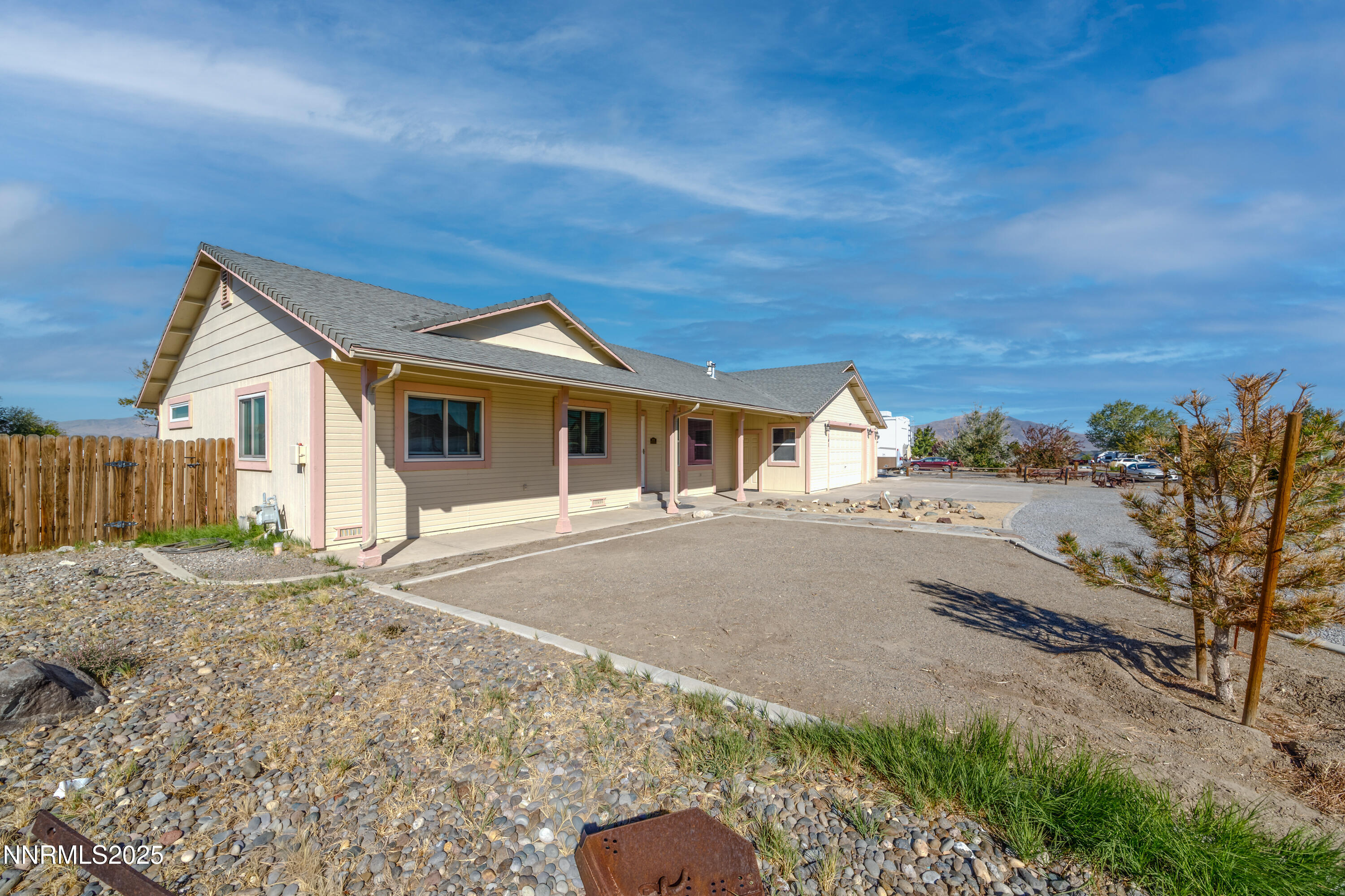 141 Country Ranch Road Fernley, NV 89408 - Photo 5 of 43 a front view of a house with a yard