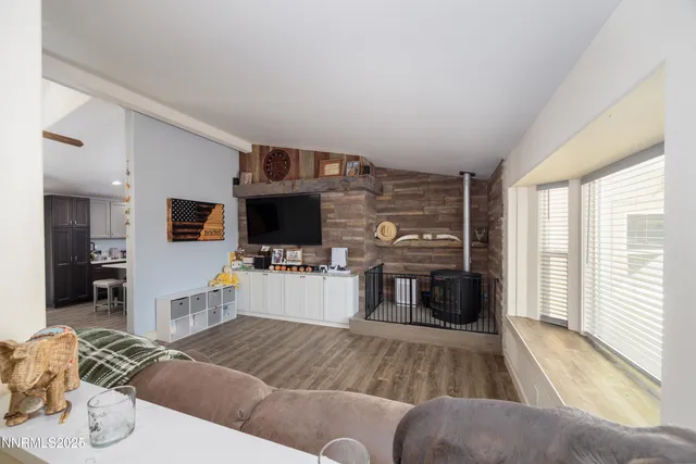 a bedroom with furniture and a window