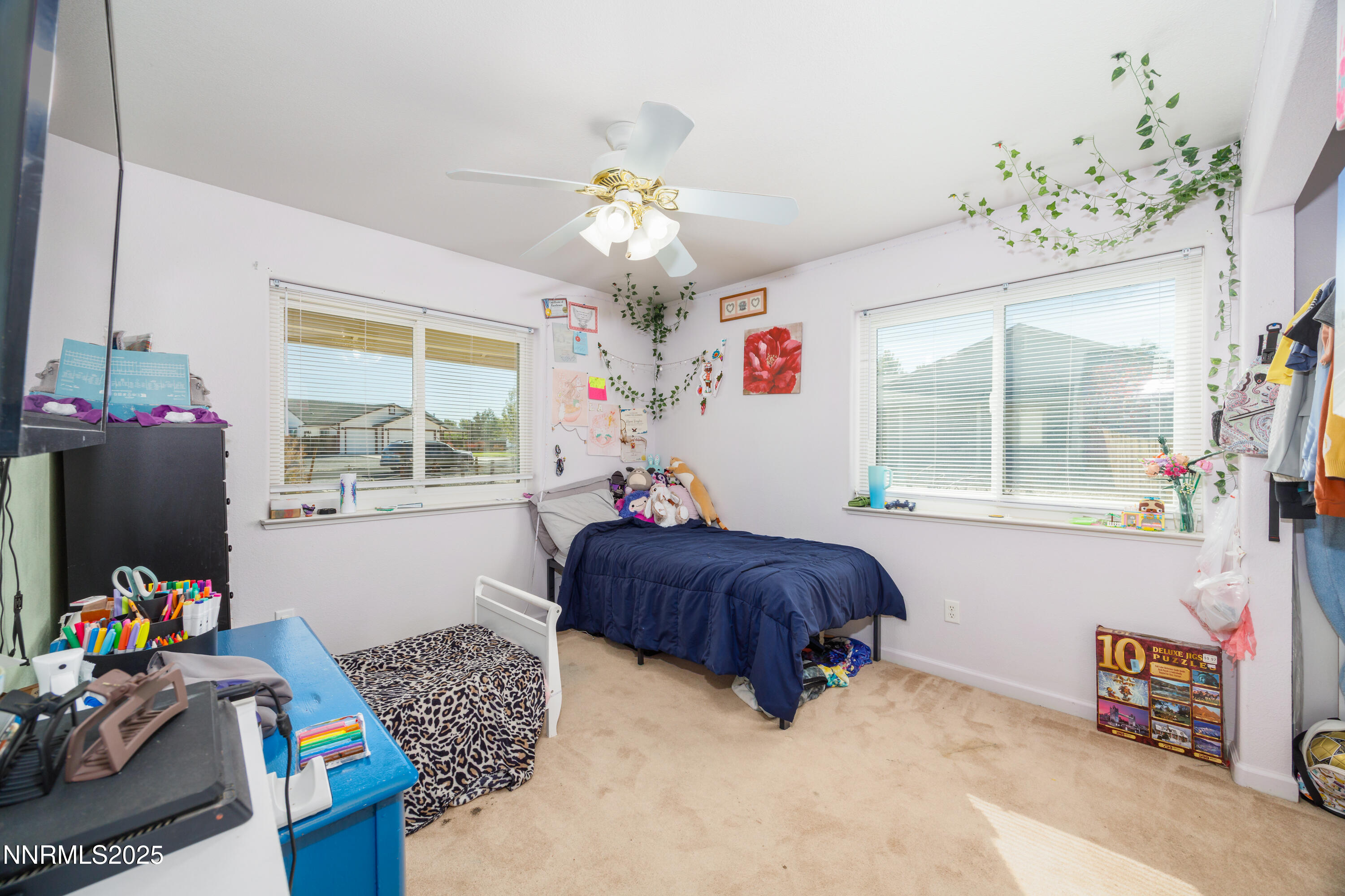 141 Country Ranch Road Fernley, NV 89408 - Photo 10 of 43 a bedroom with furniture and a window