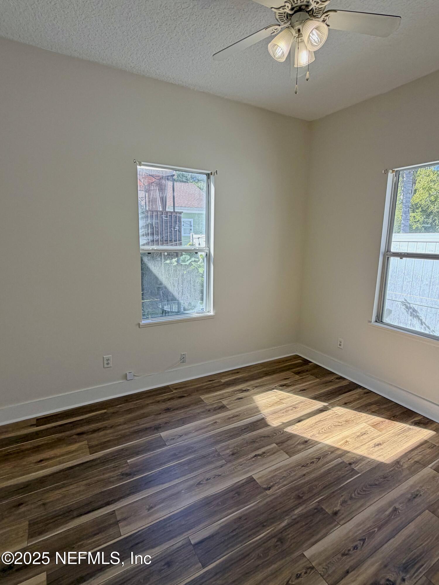 15 Hope Street St. Augustine, FL 32084 - Photo 11 of 16 an empty room with wooden floor and windows