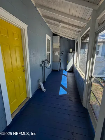 a view of a small house and a yard