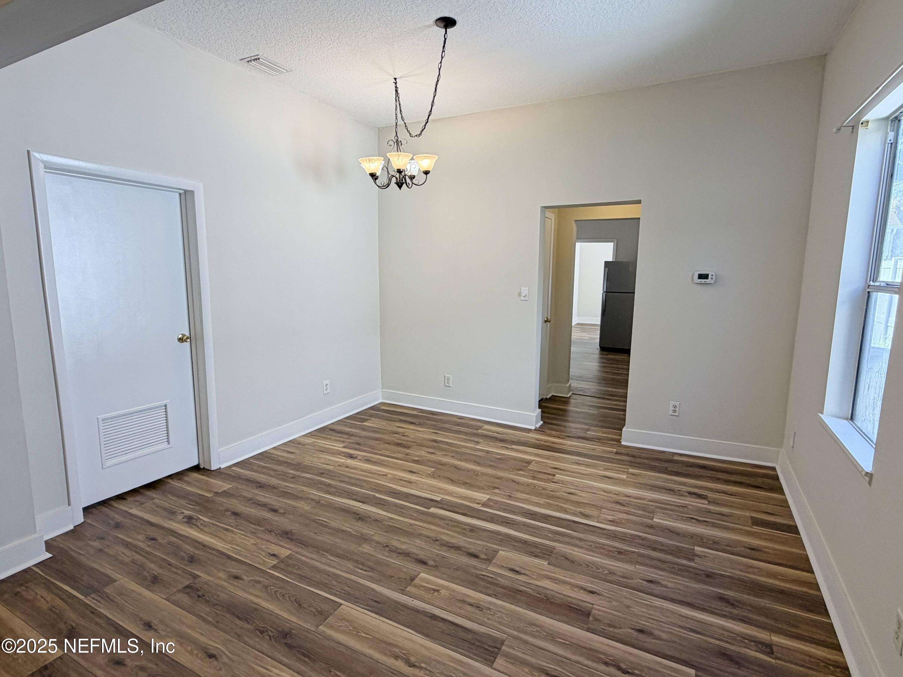 15 Hope Street St. Augustine, FL 32084 - Photo 4 of 16 a view of empty room with wooden floor and fan