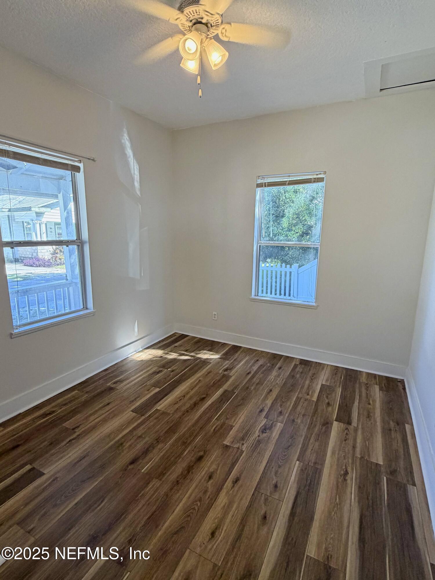 15 Hope Street St. Augustine, FL 32084 - Photo 7 of 16 a view of an empty room with wooden floor and a window