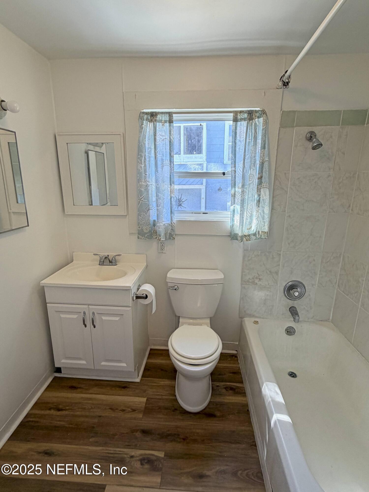 15 Hope Street St. Augustine, FL 32084 - Photo 8 of 16 a bathroom with a sink a toilet and shower