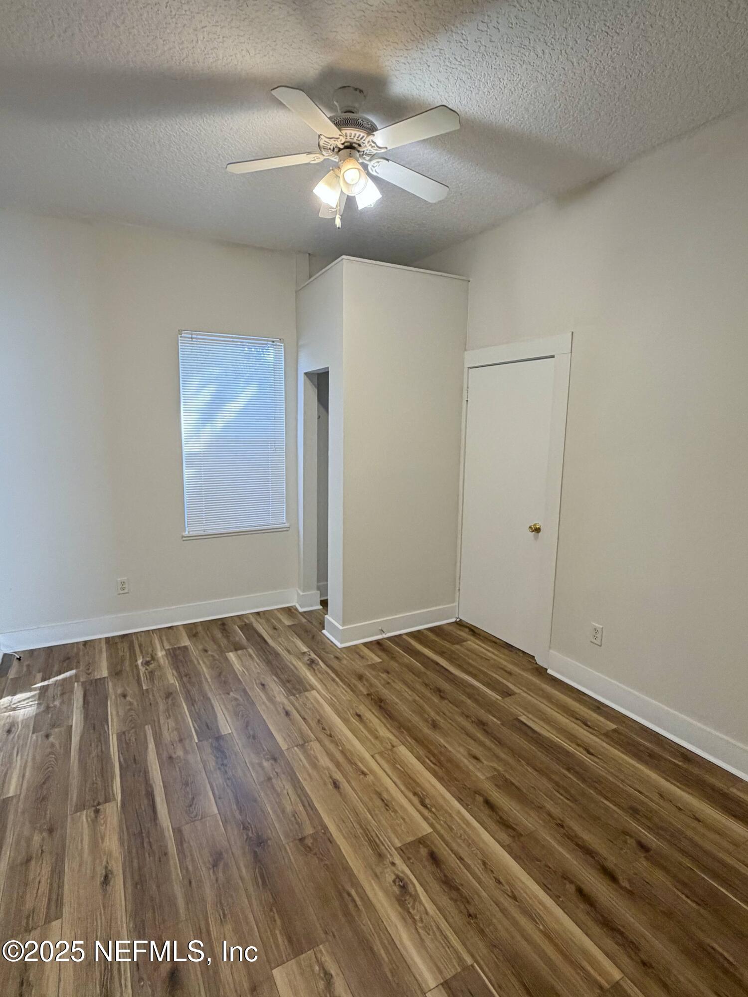15 Hope Street St. Augustine, FL 32084 - Photo 9 of 16 wooden floor in an empty room