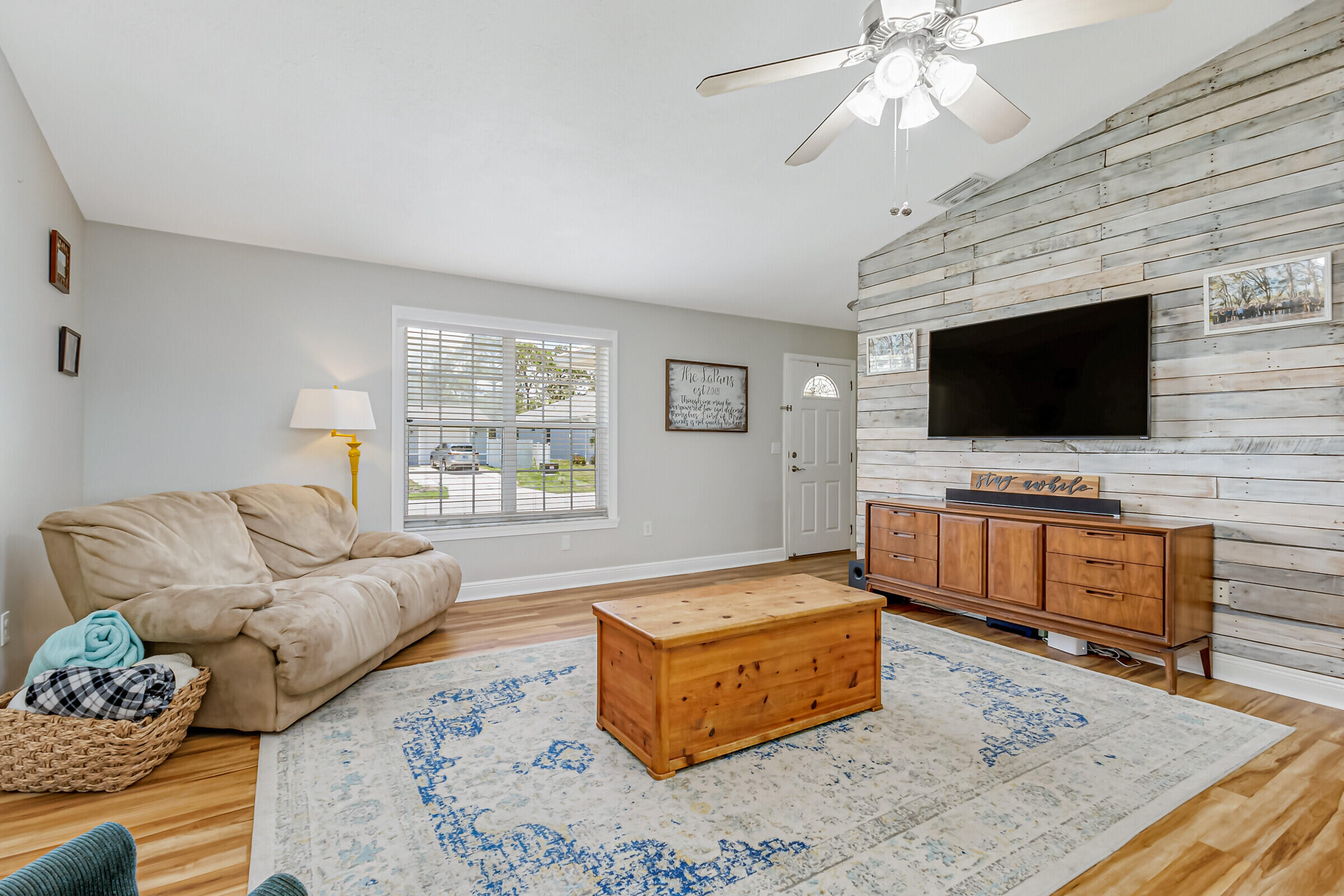 1030 San Rafael Road Southwest Palm Bay, FL 32908 - Photo 12 of 37 a living room with furniture and a flat screen tv