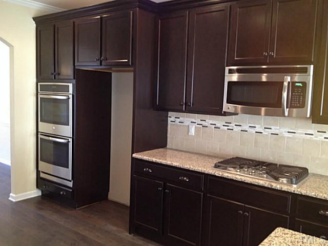 232 Strolling Way Durham, NC 27707 - Photo 5 of 22 Stainless steel GE appliance include double oven and gas cook top!