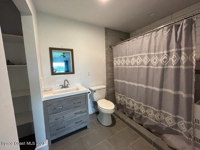 520 Atz Road, Unit COTTAGE Malabar, FL 32950 - Photo 16 of 25 a bathroom with a toilet sink and shower